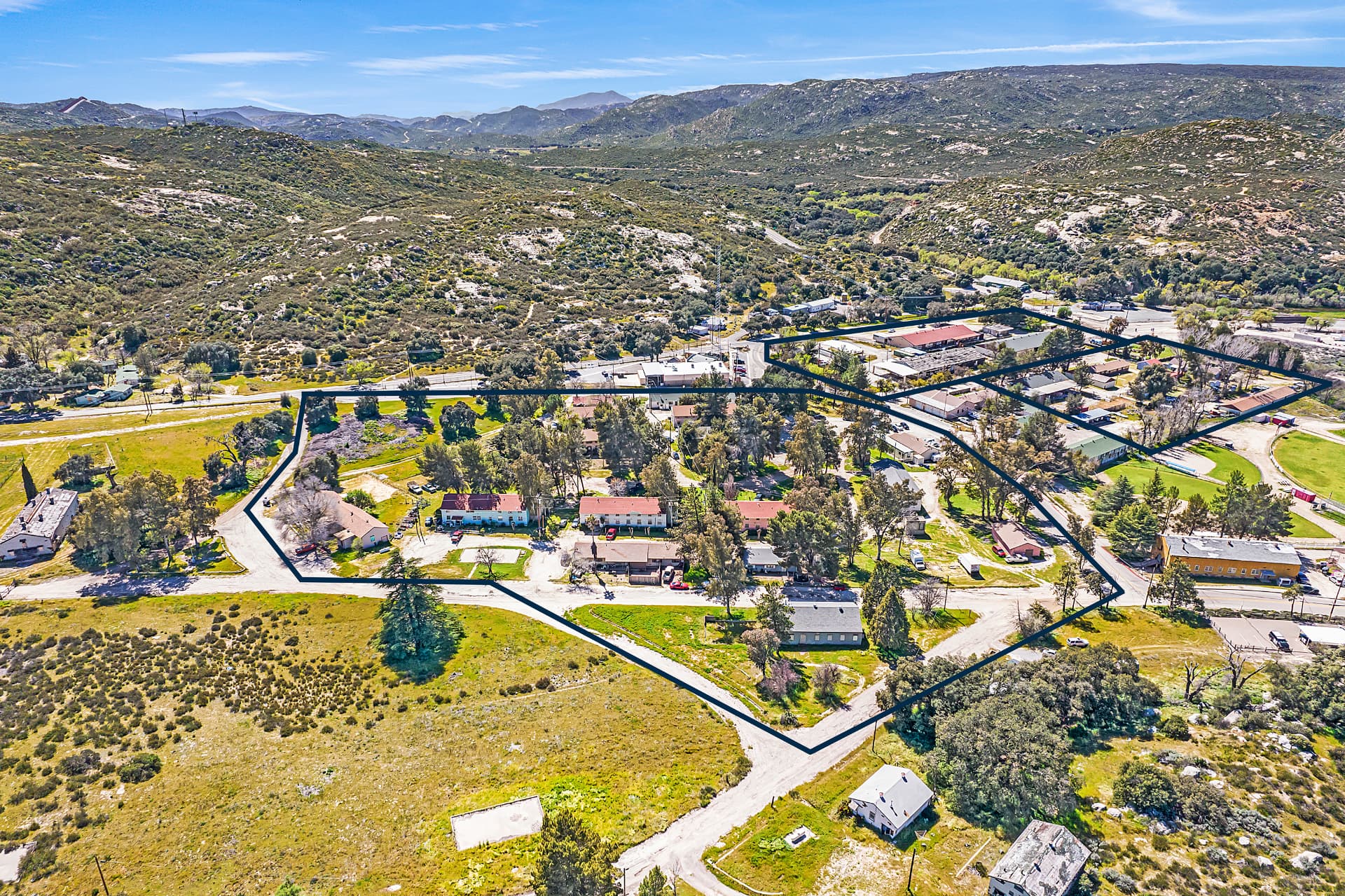 Aerial view of the Campo cottages and village parcels outlined below the backcountry hills